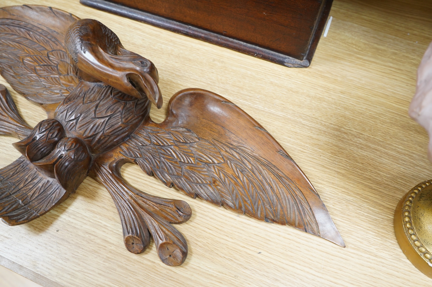 A mahogany leather-handled tool box and carved American eagle wall mount, largest 66cm wide
